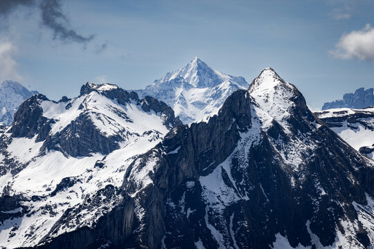 View of the snow-capped peaks and rocky ridges of the Stoos mountain range in the Swiss Alps, Schwyz, Schwyz, Switzerland.