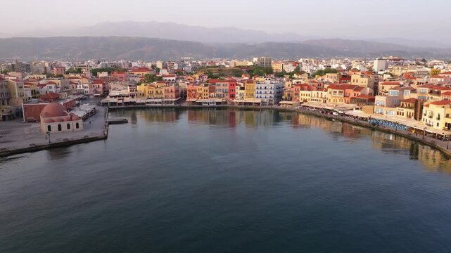 Beautiful Old city, Greece and best scenic places - panorama of picturesque old town Chania. Crete island, Panoramic of the old Venetian port and lighthouse during the blue hour, Travel Concepts