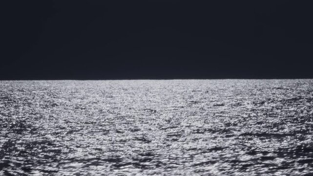 Dark Atlantic Ocean and stormy clouds as seen from the moving sailing boat