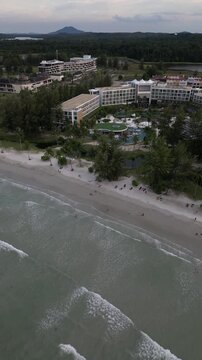 Aerial view of Four Points by Sheraton Bintan resort with swimming pools and lush tropical gardens along the sandy beach in Bintan, Kepulauan Riau, Indonesia.