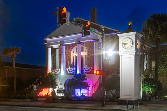 Evening view of the illuminated Town Clock and Conway City Hall building built in 1825 as a courthouse, on the historic Main Street of the picturesque small town of Conway, South Carolina.	