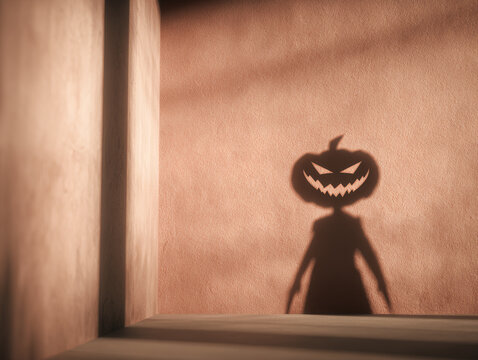 かぼちゃ頭の人影が壁に映るハロウィンの影