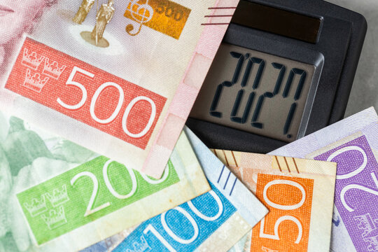Swedish krona 2027. Business concept in finance. Money and calculator with the date 2027. Market analysis. Currency of Sweden. Exchange rate. Economic background. Close up