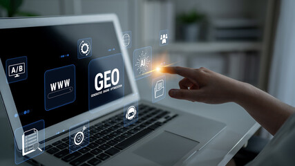 Obraz premium Hand Interacting with Laptop Displaying Geo-Targeting and Artificial Intelligence Graphics for Digital Strategy and Marketing Concepts. Glyphic.