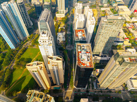 Aerial view of Bonifacio Global City skyline with modern skyscrapers, glass towers, and urban streets in Makati City, Metro Manila, Philippines.