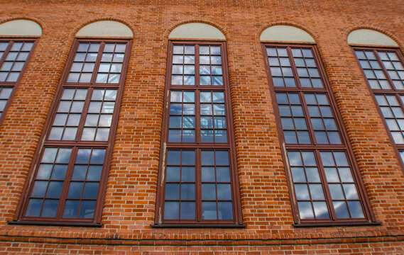 Close up of long windows on a brick wall, Gdansk, Poland