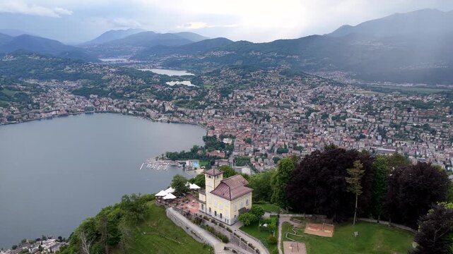 Aerial view of Monte Bre overlooking the city of Lugano and Lake Lugano with surrounding mountains in Lugano, Ticino, Switzerland.