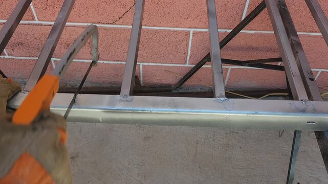 Manual Cutting of Iron Frame Structure Using Hacksaw Tool