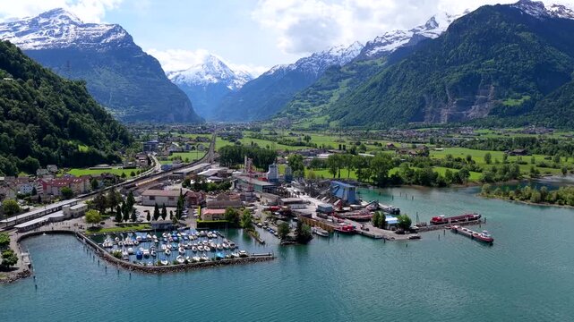 Aerial view of the marina and industrial area on the shores of Lake Lucerne in Fluelen, Uri, Switzerland.