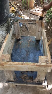 Painting Edges of Wooden Base Structure with Black Paint