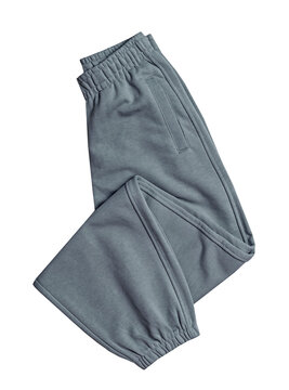 Grey gray folded sport joggers isolated, casual pants,trousers cutout. Fitness clothes.