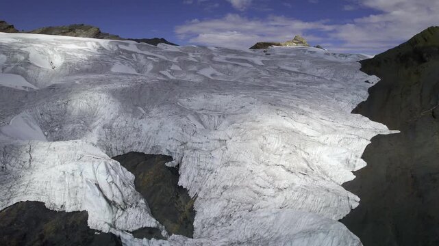 Aerial view of the expansive ice fields and rugged terrain of Pastoruri Glacier in Recuay Province, Ancash, Peru.