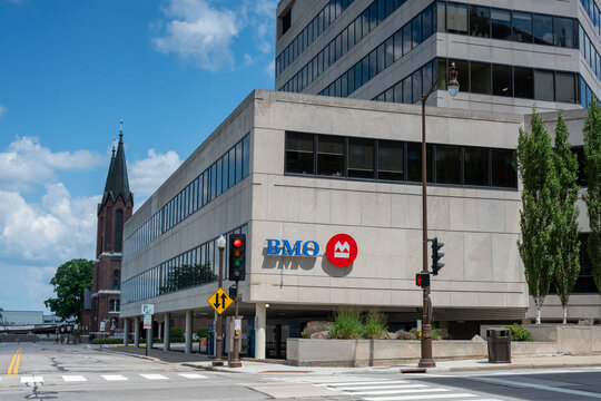 Wausau, WI, USA - Jul 11, 2026: BMO bank branch in downtown with a church in the background.