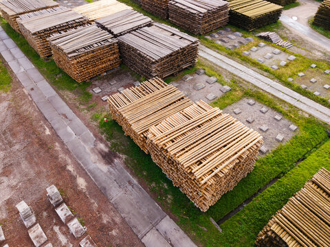 Aerial view of stacked timber logs in a lumber yard, representing sustainable construction and mass timber resources in Brankas, Jelgava Municipality, Latvia.