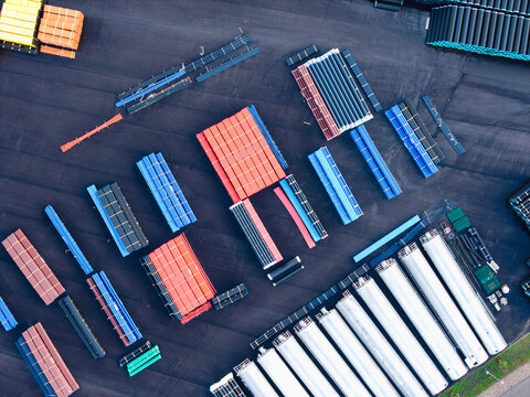 Aerial view of stacks of colorful plastic pipes at a polymer pipe manufacturing facility in Jelgava, Latvia.