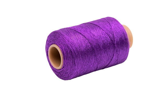 Vibrant purple thread spool with cardboard core, isolated on transparent background