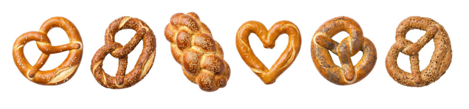Assortment of freshly baked soft pretzels and braided bread featuring various toppings like salt, poppy seeds, sesame, and multigrain in different shapes