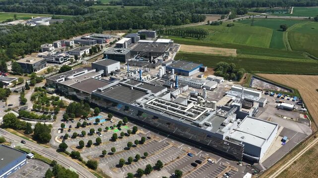 Bernin, France - August 1, 2026: Wide aerial view of Soitec semiconductor manufacturing complex producing advanced silicon wafers and materials for the global microelectronics industry