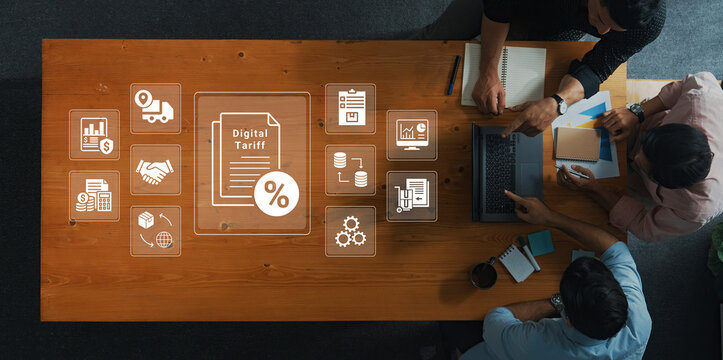 Collaborative Workspace Showing Digital Tariff Concept with Businessmen Analyzing Data on Laptop Surrounded by Graphs and Icons. Glyphic.