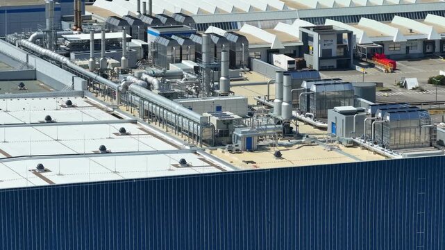 Crolles, France &ndash; 1 August 2026: Drone view of complex rooftop HVAC, piping and industrial utility systems at the STMicroelectronics semiconductor fabrication facility.