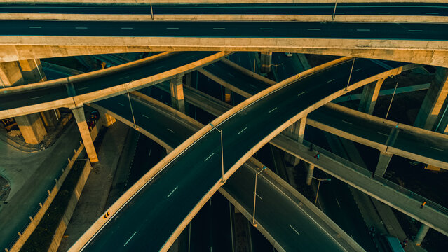 Aerial view of the multi-level Pokuase Interchange featuring complex concrete pillars and asphalt roads in Ga North Municipal, Greater Accra Region, Ghana.