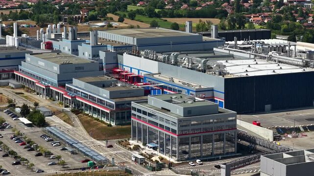 Crolles, France &ndash; 1 August 2026: Drone view of STMicroelectronics semiconductor fabrication facilities, showing industrial buildings and rooftop infrastructure at the Crolles microelectronics site.