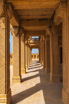 View of the intricately carved sandstone columns and geometric patterns at the historic Makli Necropolis in Thatta, Sindh, Pakistan.