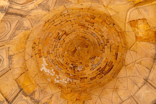 View of the intricate concentric brick dome ceiling at the historic Makli Necropolis in Thatta, Sindh, Pakistan.