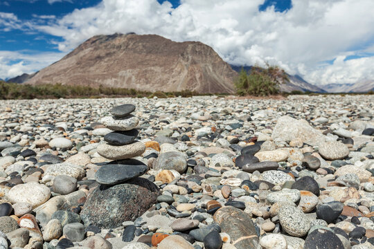 Zen balanced stones stack in Himalayas mountains. Nubra valley, Ladakh, Jammu alongside Kashmir, India