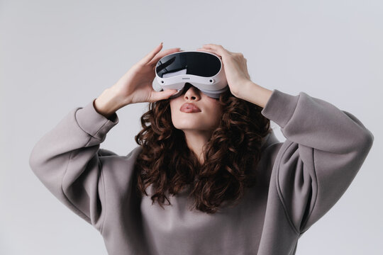 Young asian woman curly hair wearing virtual reality headset