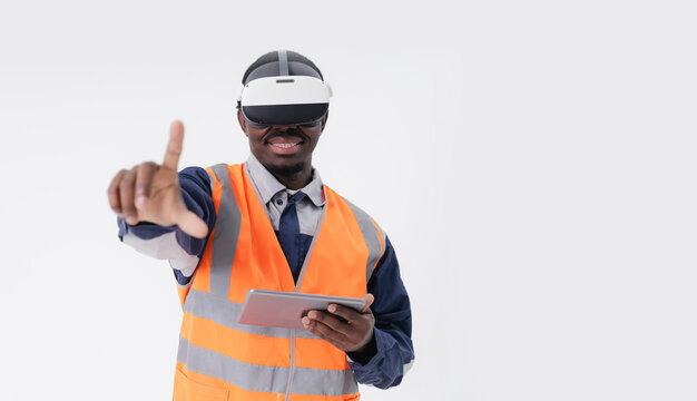 Engineer Touching virtual display African adult male using vr headset and tablet for virtual construction simulation.