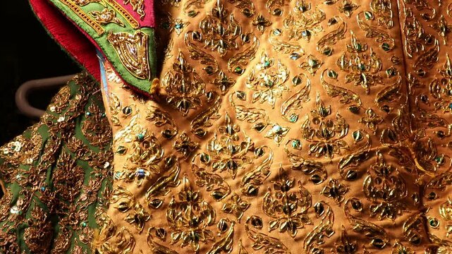 Traditional Thai Khon performance costume hanging on a clothes rack in Bangkok.