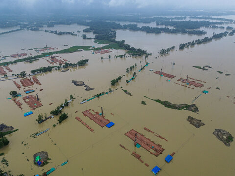 Aerial view of flooded brick kilns surrounded by vast floodwaters in Satkania Upazila, Chittagong Division, Bangladesh.