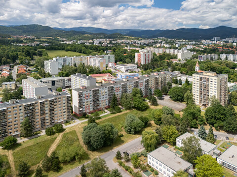 Aerial view of the Radva housing estate featuring residential apartment blocks surrounded by green spaces and trees, Banska Bystrica District, Banska Bystrica Regio, Slovakia.