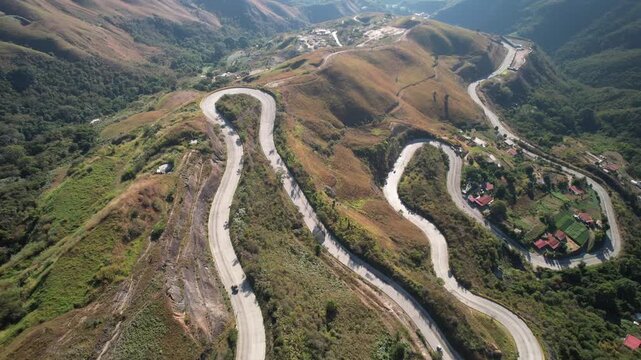 Aerial view of the winding mountain road through the lush hills of Colonia Tovar, Caracas, Miranda, Venezuela.