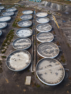 Aerial view of the decommissioned salt processing plant featuring numerous circular basins and industrial infrastructure in Avalon, Victoria, Australia.