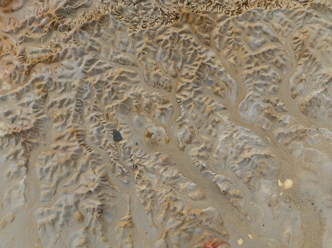 Aerial view of the intricate, dendritic drainage patterns and eroded terrain of the Bangka Belitung Islands, Indonesia.