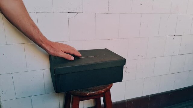 Person casting vote in ballot box during election animation footage clip