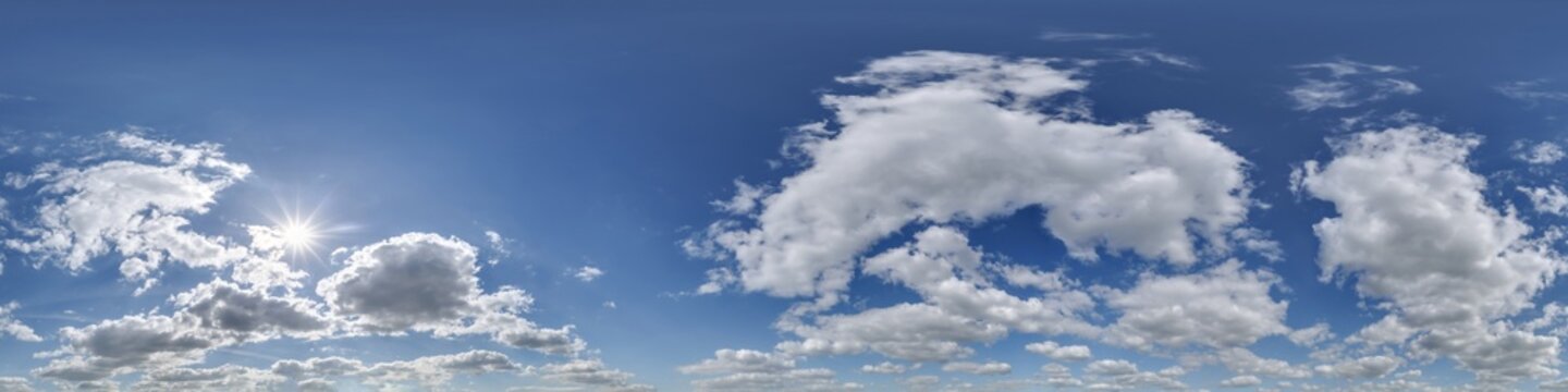 360 hdri blue sky with beautiful clouds with halo like a seamless panorama view with zenith for use in 3d graphics or game development as sky dome or edit drone shot