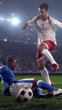 Soccer Player Jumping Over a Sliding Tackle