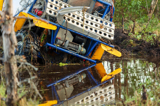 View of an off-road vehicle stuck in a muddy pool near the shores of Lake Ladoga in Sortavala, Respublika Kareliya, Russia.