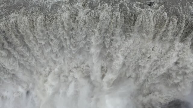 Aerial view of the powerful Selfoss waterfall with cascading water and mist in Selfoss, Sveitarfelagid Arborg, Iceland.