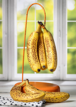 Brown heavily spotted bananas very soft and sweet perfect for baking or smoothies. Vertical stock photo taken by kitchen window.
