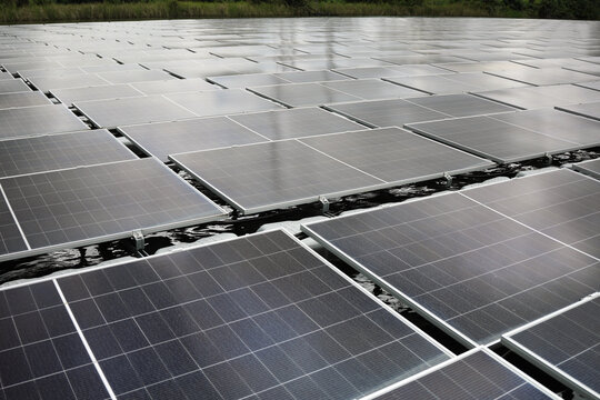 Aerial view of floating solar panels installed on a water reservoir in Berau Regency, East Kalimantan, Indonesia.