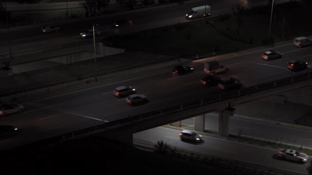Aerial view of highway traffic at night with cars moving along the road in Algeria.