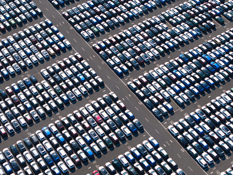 Aerial view of the BCA Kia car distribution service facility featuring rows of parked vehicles organized in a large outdoor storage lot in Stallingborough, England, United Kingdom.