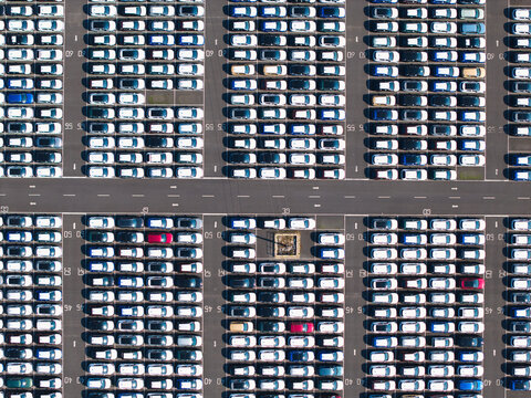 Aerial view of BCA Kia car distribution service with rows of parked vehicles in a large outdoor storage lot in Stallingborough, England, United Kingdom.
