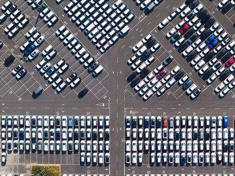 Aerial view of BCA Kia car distribution service with rows of parked vehicles in a large lot in Stallingborough, England, United Kingdom.