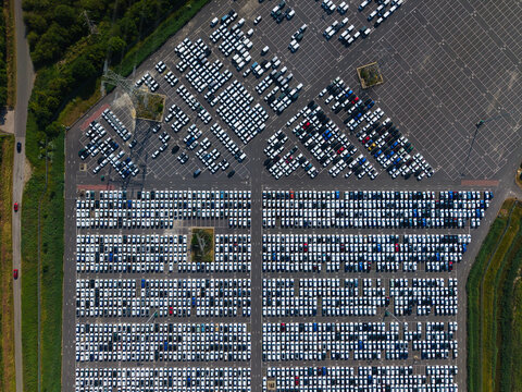 Aerial view of the BCA Kia car distribution service facility featuring rows of parked vehicles in a large parking lot in Stallingborough, England, United Kingdom.