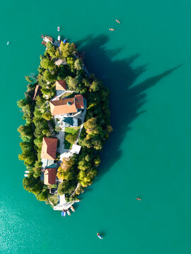 Aerial view of Lake Bled with its iconic island, church, and surrounding turquoise water in Bled, Radovljica, Slovenia.